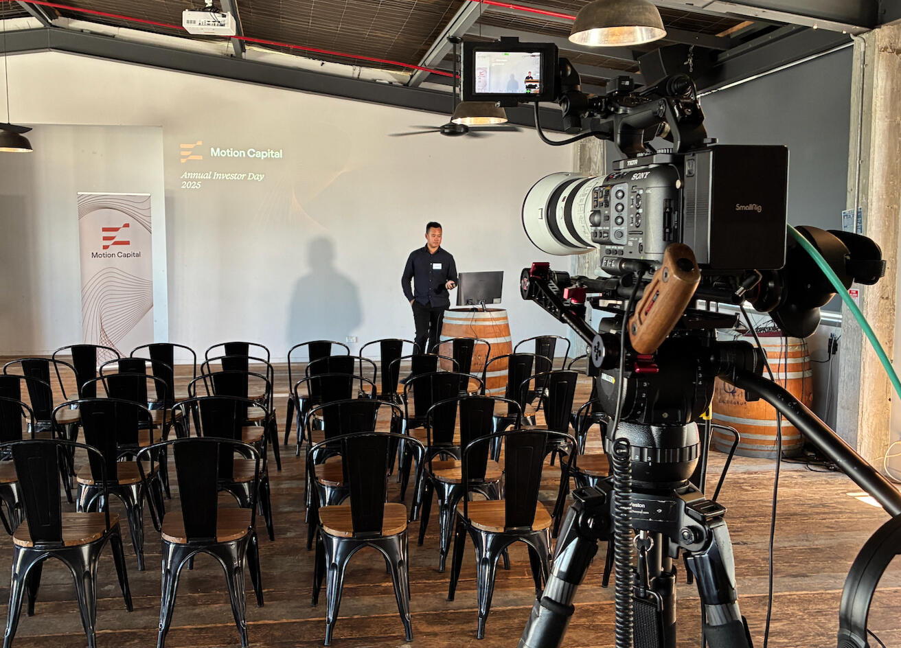 Single-camera livestream setup for a corporate presentation.